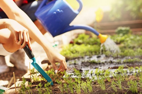 Front view of a gardener arriving at a residential property